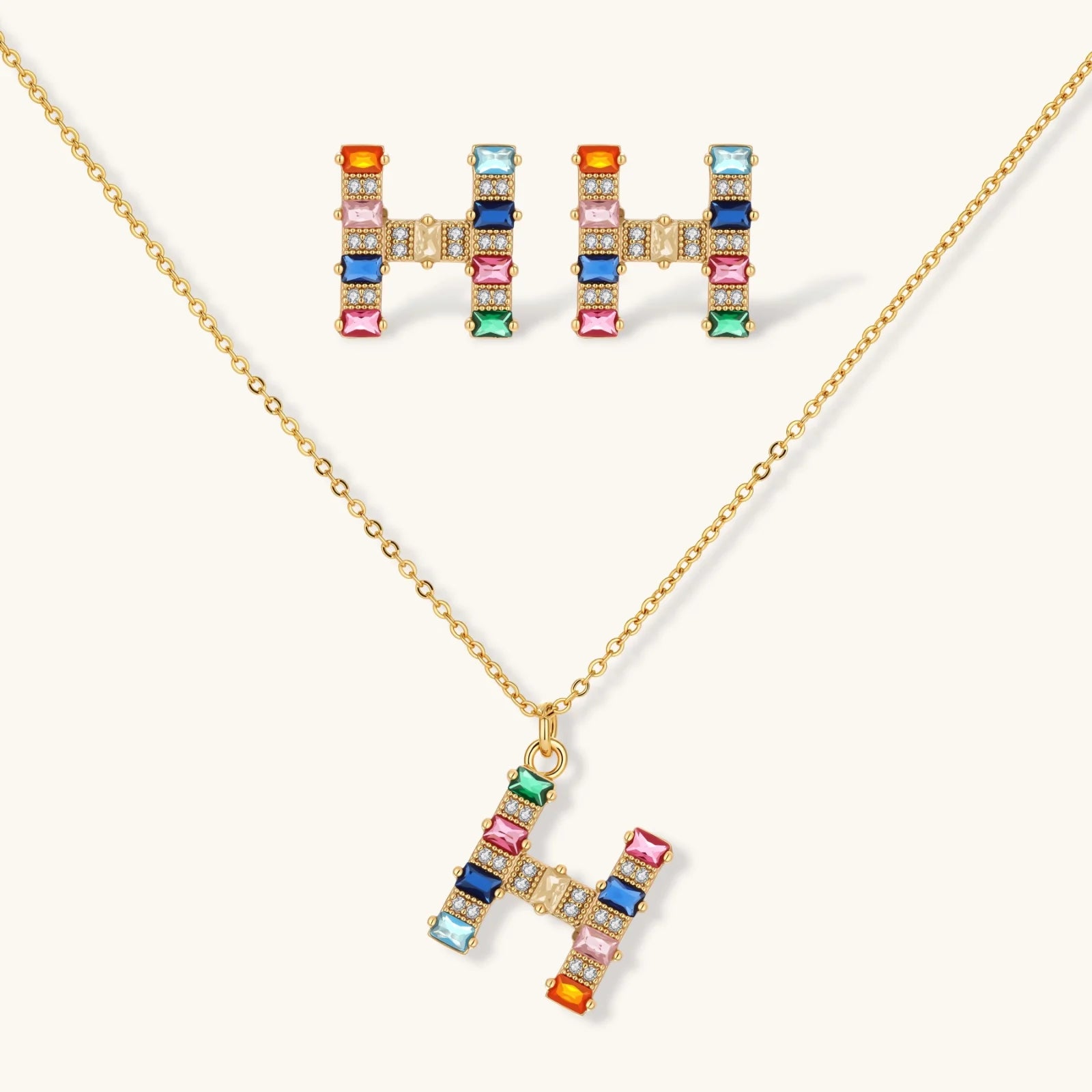 Letter H jewelry set featuring geometric crystal design in gold and white gold plated finish with adjustable chain necklace