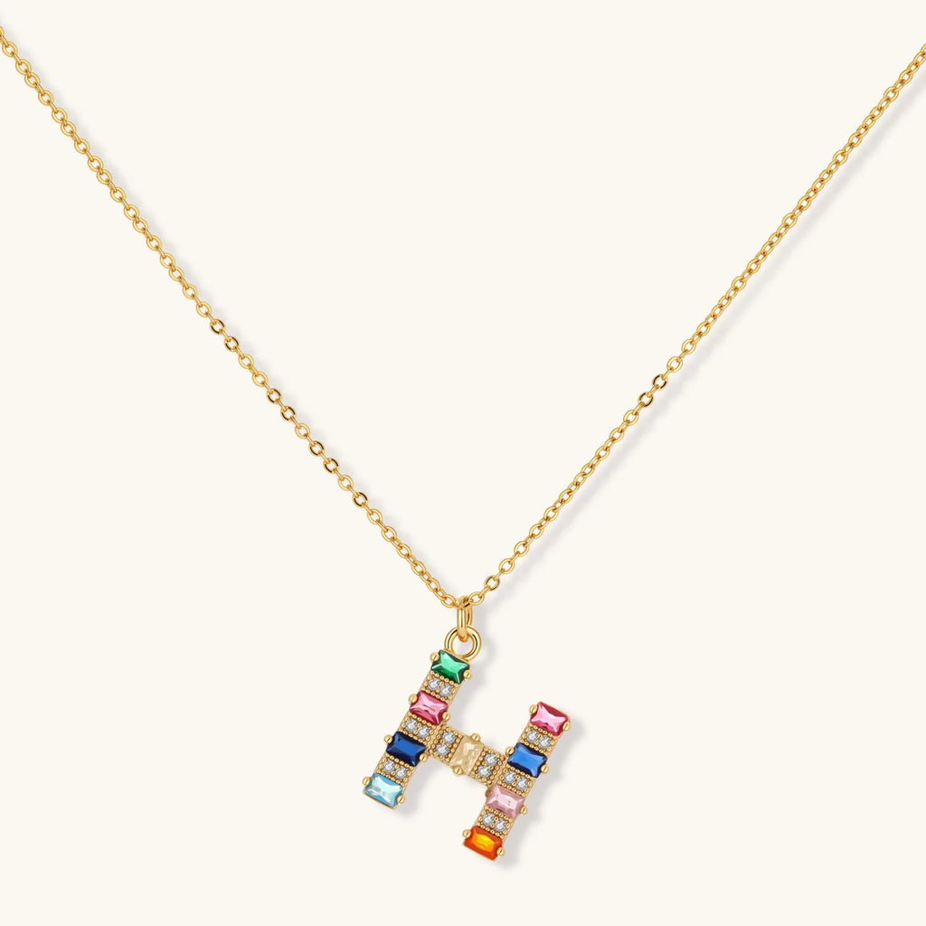 Letter H jewelry set featuring geometric crystal design in gold and white gold plated finish with adjustable chain necklace