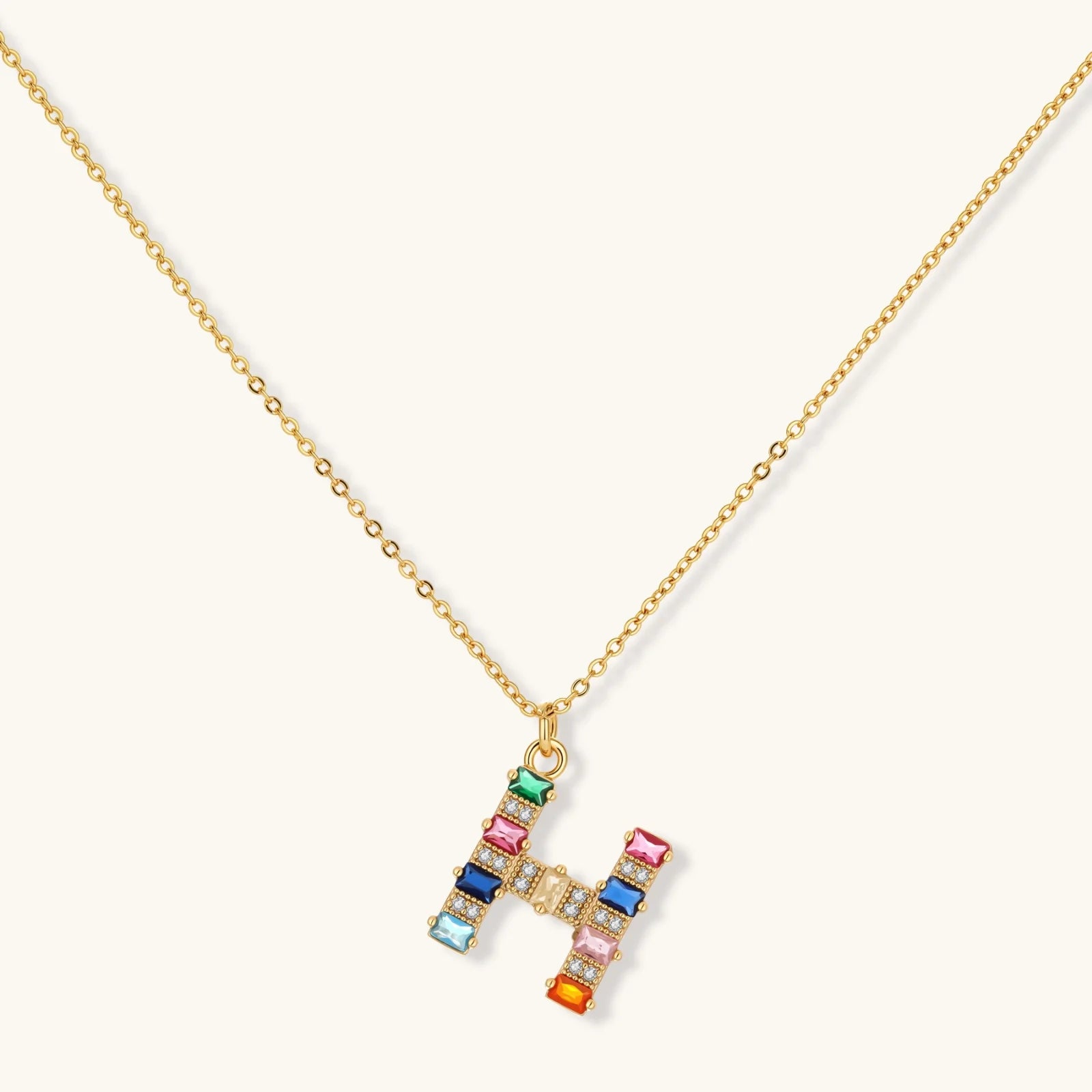 Letter H jewelry set featuring geometric crystal design in gold and white gold plated finish with adjustable chain necklace