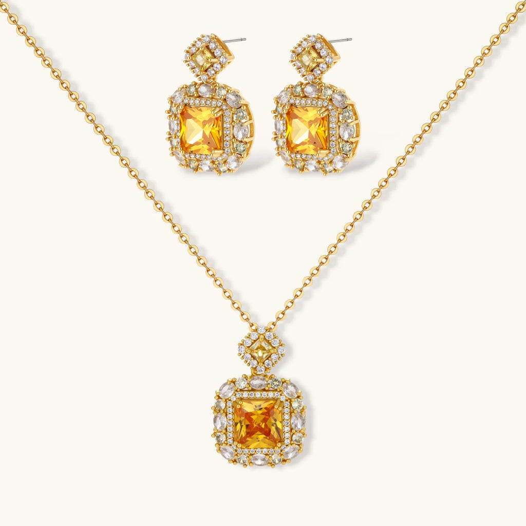 14K gold-plated jewelry set featuring square-cut cubic zirconia stones in ornate layered settings on white background.