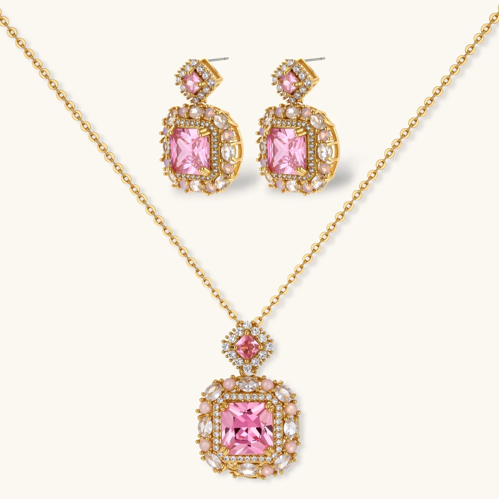 14K gold-plated jewelry set featuring square-cut cubic zirconia stones in ornate layered settings on white background.