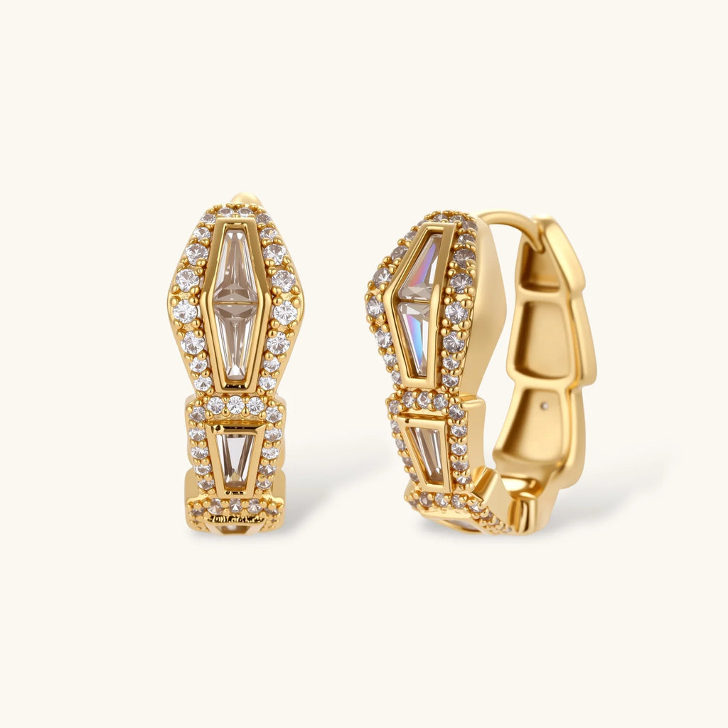 Gold-plated necklace with geometric diamond segments and matching huggie earrings featuring cubic zirconia details